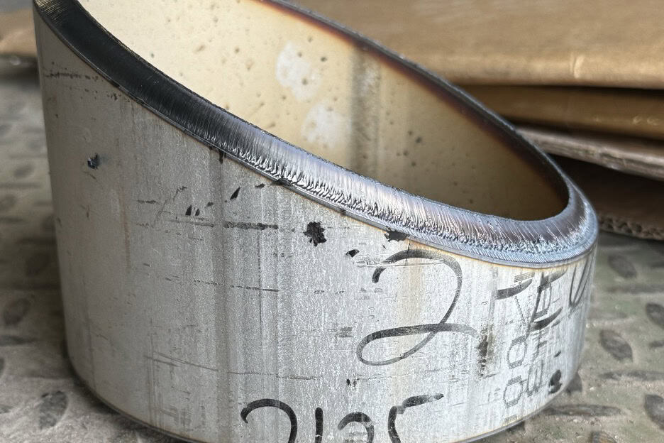 Plasma-cut miter on heavy-wall round pipe. Square, consistent, and ready for fit-up.